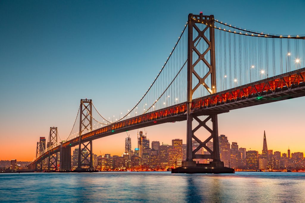 San Francisco skyline with Oakland Bay Bridge at sunset, California, USA